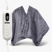 Grijze elektrische poncho met drukknopen naast de afstandsbediening met display